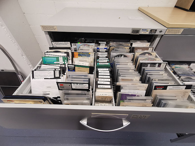 Drawer with floppy disks and other storage media in different sizes